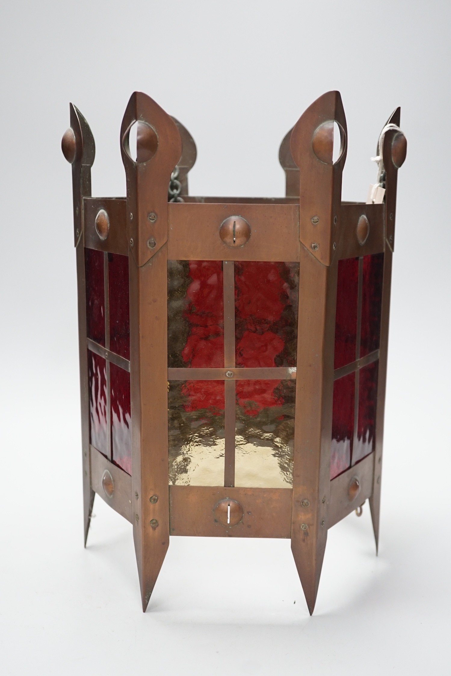 An Arts & Crafts copper and coloured glass hall lantern, 35cm